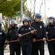 Police officers in riot gear walk toward protesters along Reisterstown Road near Mondawmin Mall on April 27, 2015, in Baltimore. A group of young protesters clashed with police in the streets near Mondawmin Mall in the afternoon following Freddie Gray’s funeral.
Drew Angerer/Getty Images